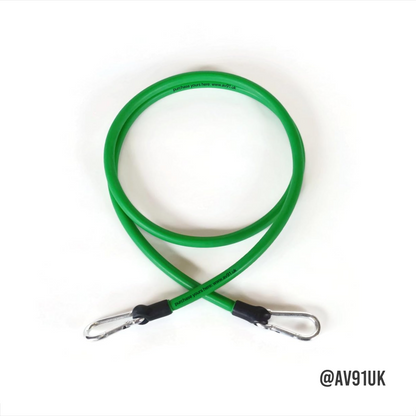 Green resistance band with foam handles and carabiner clips. Perfect for strength, boxing, and mobility training at home or in the gym. Portable and durable.